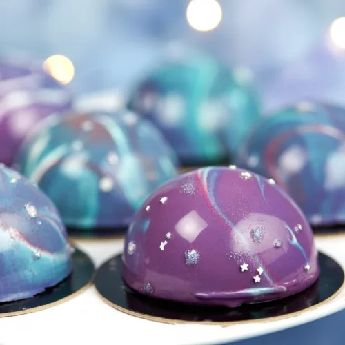 Galaxy Mousse Cake with a glossy mirror glaze showcasing vibrant colors and textures.