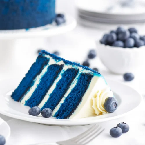 Delicious Blue Cake topped with cream cheese frosting for a festive occasion.